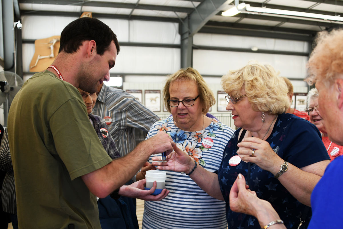 048 Deb Figgner and Bernice Mettenbrink see the sparkle of the ash particles under light.JPG